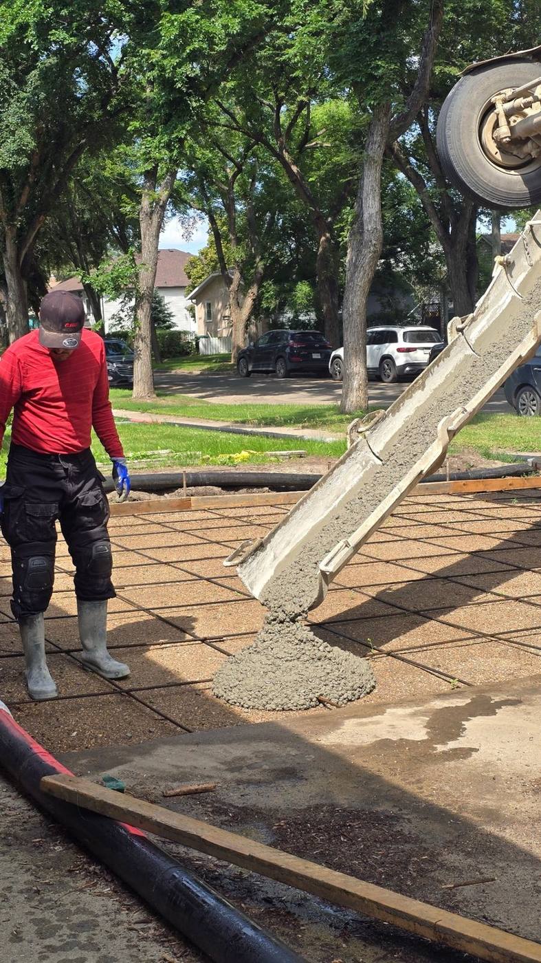 AB Concrete Finishing crew placing concrete on a builder project